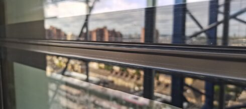 Glazing transom on a high-rise building with a city view