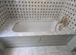 Built-in bath with marble deck, gold taps and black and white tiles, sealed, Bedford