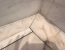 Fine white silicone joints where a marble shower floor meets the marble wall tiles
